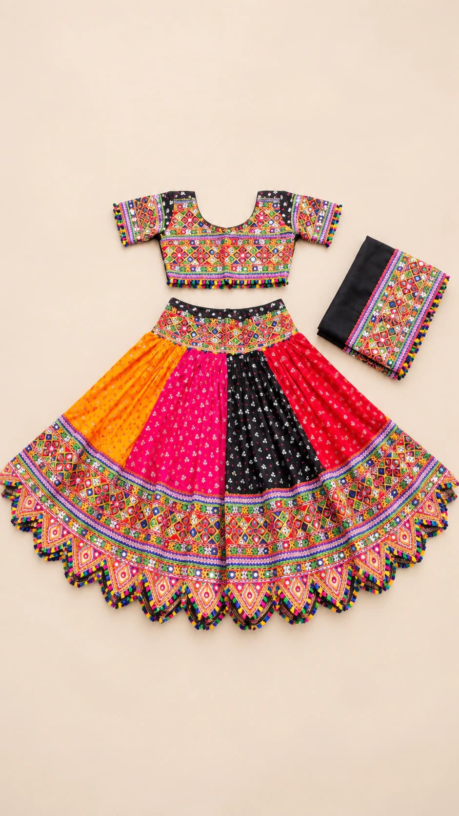 Sunset Tassel: A spirited orange, pink and black three-piece set with a patchwork-style border, dotted panels and playful tassel edging.