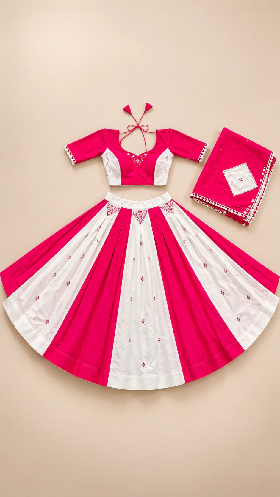 Pink Blossom: A graphic rani-pink and ivory ensemble with broad alternating skirt panels, a cropped blouse and a coordinated pink dupatta.