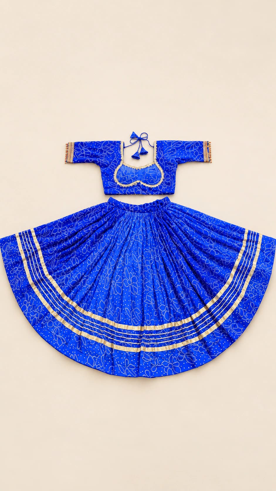 Royal Sapphire: A striking royal-blue lehenga set with a fine all-over pattern, clean silver-toned border lines and an elegant full flare.