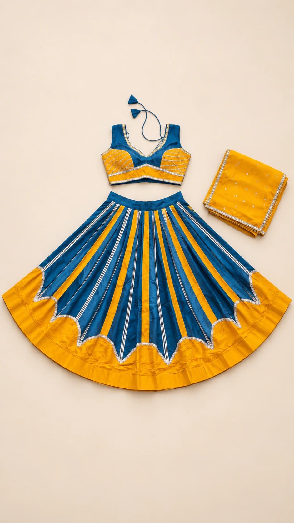 Teal Marigold: A teal and marigold set with vertical striped panels, a scalloped transition at the hem and a clean sleeveless blouse.