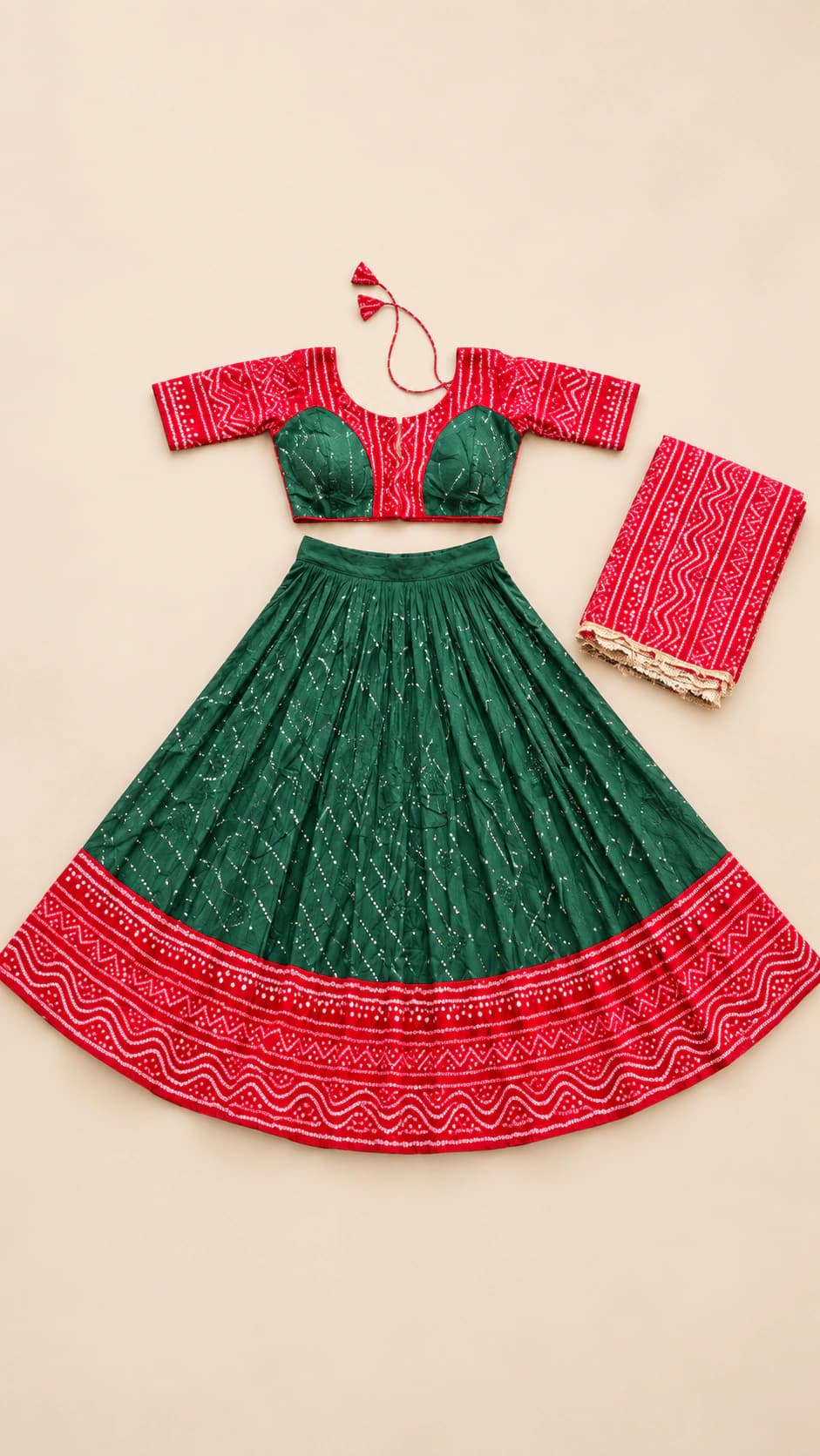 Emerald Grace: An emerald green lehenga paired with a red-and-green blouse, dense tonal patterning and an ornate scarlet hem border.