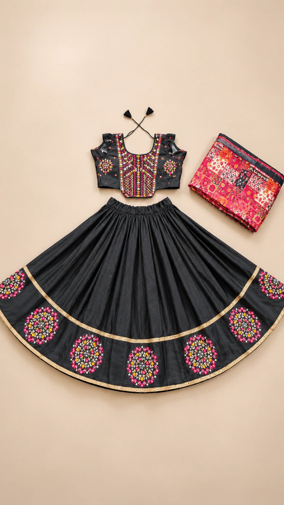 Noir Medallion: An elegant black set with a vertically patterned blouse, circular folk medallions and refined gold-toned piping at the skirt hem.