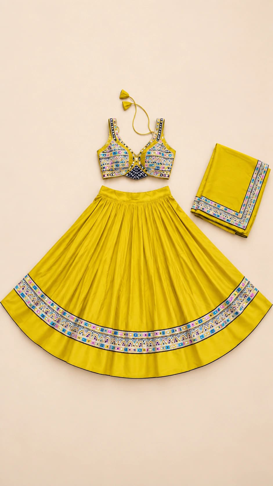 Marigold Shine: A radiant marigold-yellow ensemble with a patterned sleeveless blouse and a bright silver-toned decorative band at the hem.