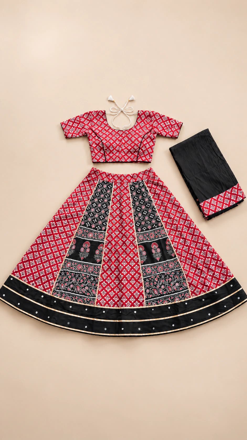 Rose Noir: A rose-pink and black lehenga with striking geometric panel blocks, patterned short sleeves and a strong dark hem border.