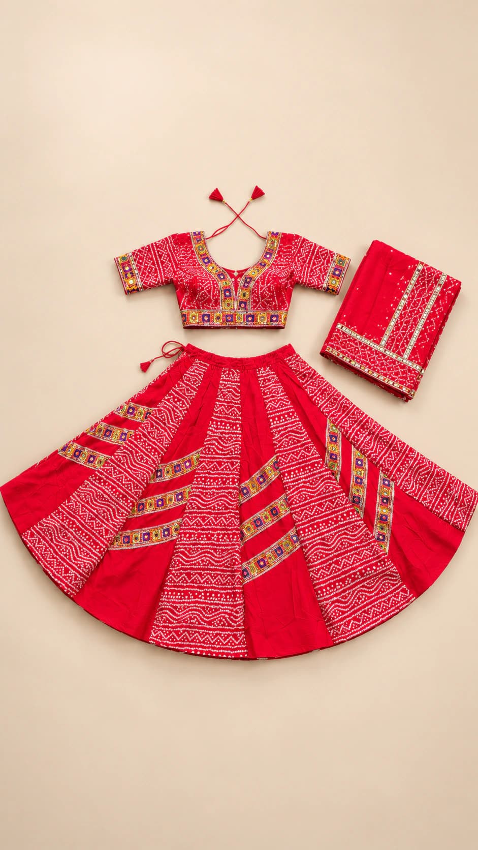 Scarlet Temple: A saturated scarlet ensemble layered with traditional geometric bands across the blouse, skirt panels and matching dupatta.