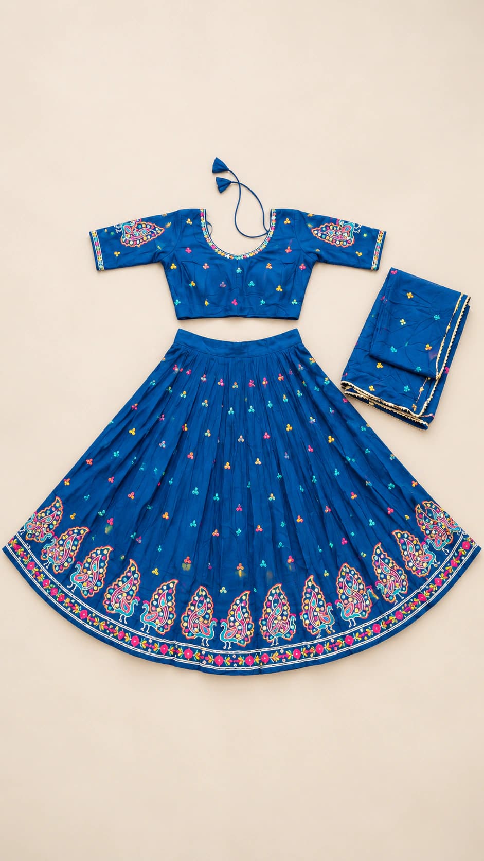 Cobalt Paisley: A cobalt-blue set with tiny scattered motifs, an ornate paisley-inspired hem band and a coordinating blue dupatta.