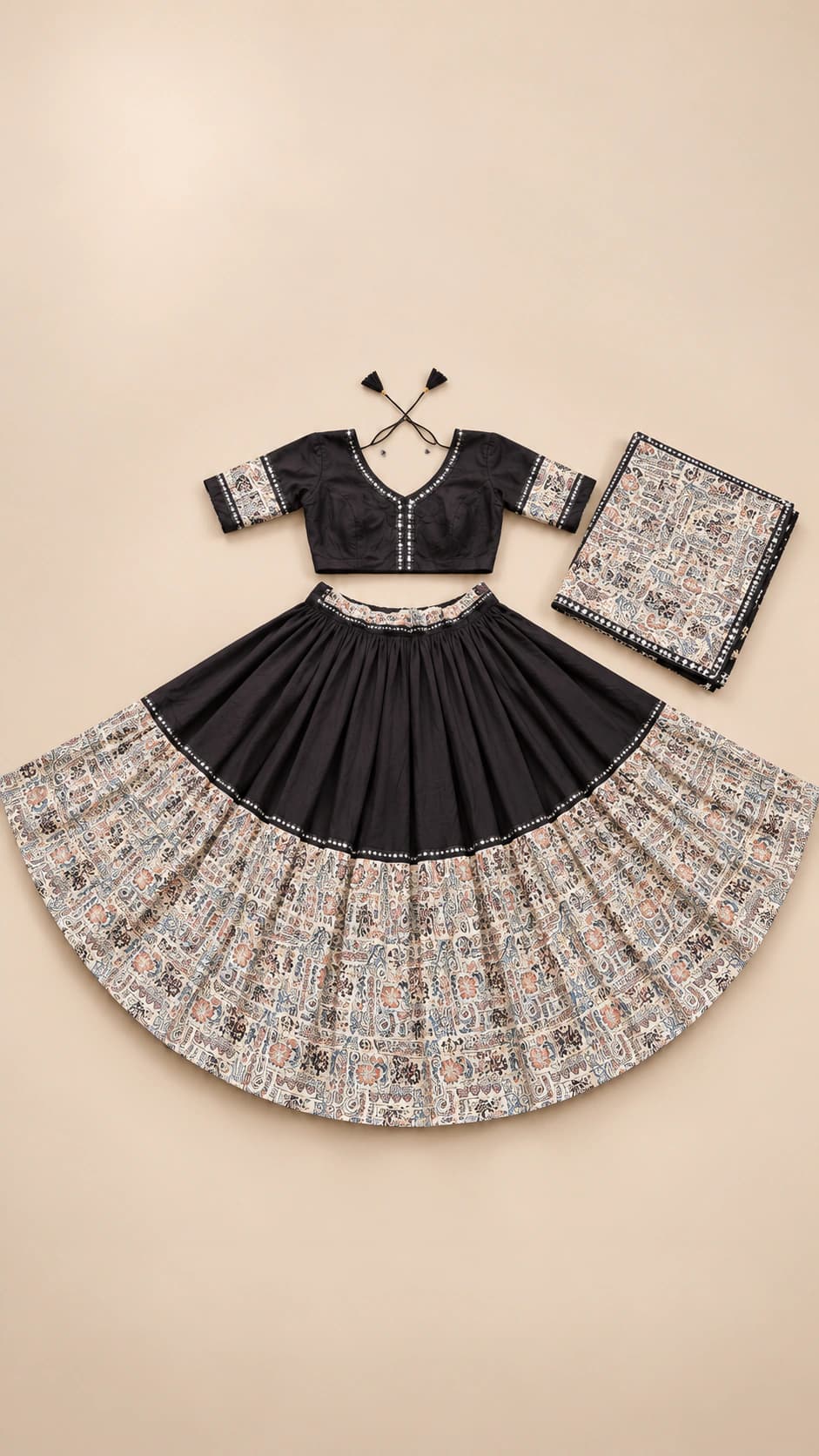 Monochrome Story: A black-and-ivory statement set with a wide narrative-style printed border, dark fitted blouse and matching monochrome dupatta.