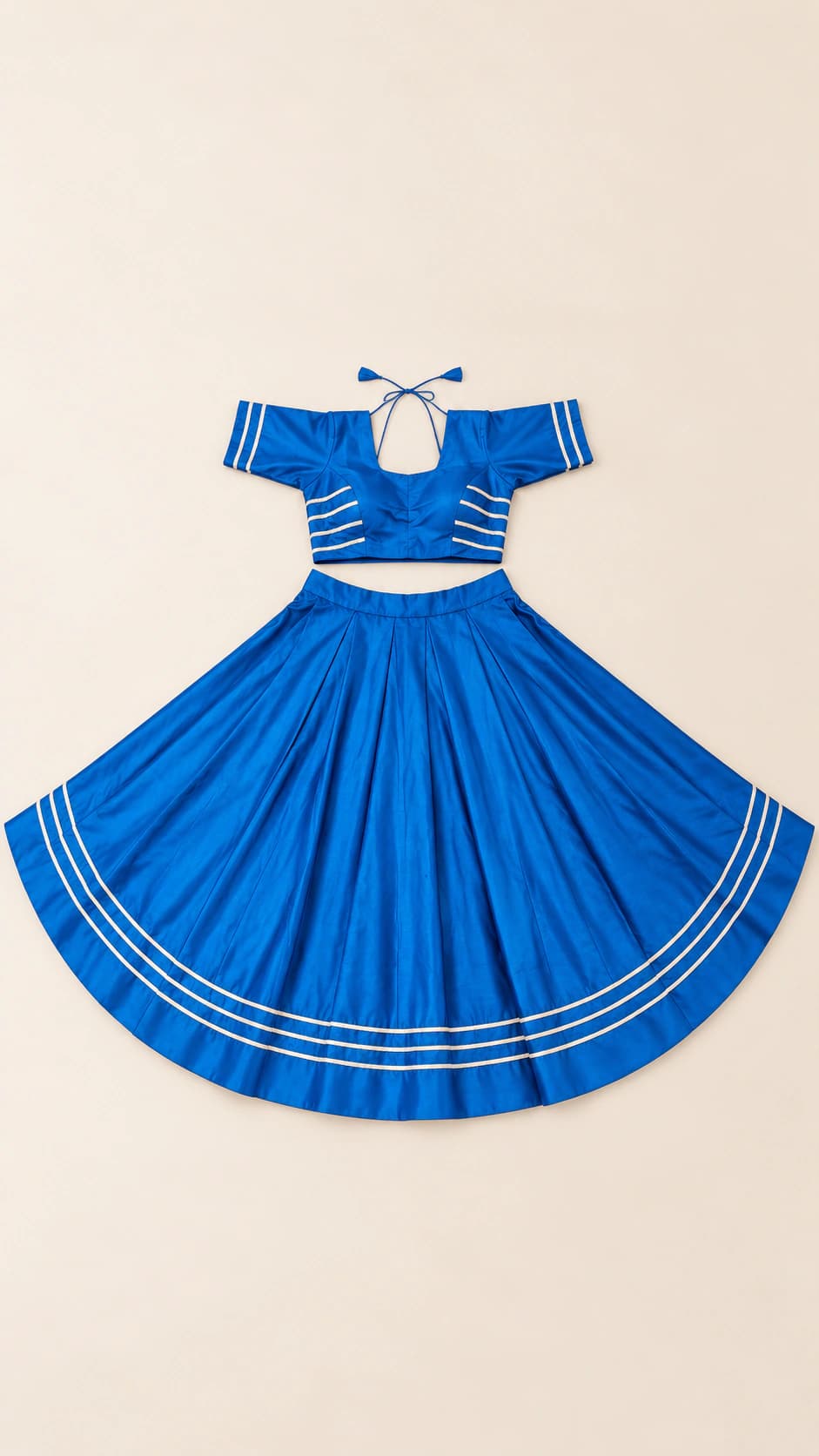 Azure Sky: A clean azure-blue festive set with a tie-back short-sleeve blouse, uninterrupted flare and three fine ivory hem lines.