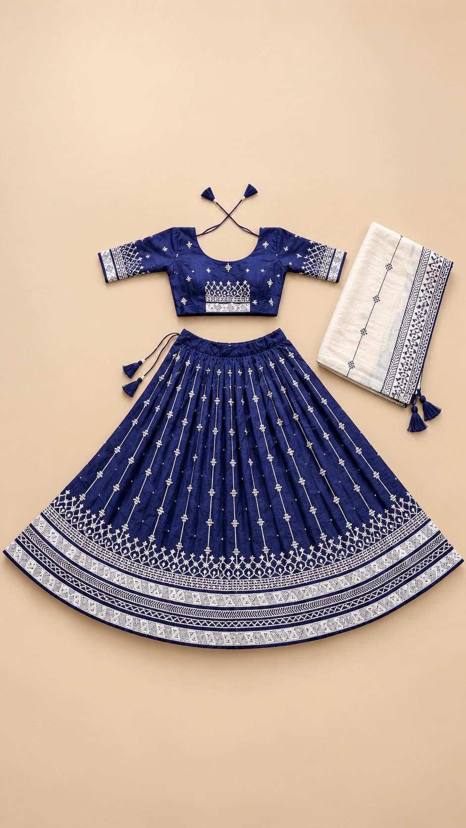 Silver Night: A refined navy festive set with sparkling-looking dotted lines, an ornate silver-toned hem border and a pale coordinating dupatta.